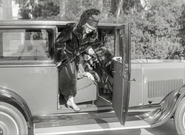 Photo showing: Fashion Plate -- From circa 1924 San Francisco comes this modishly draped miss descending from her sedan.