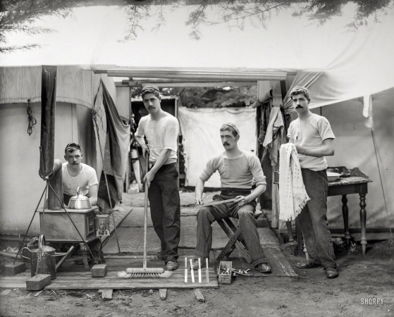 Photo showing: The Four Blades -- New Zealand circa 1905. Young men doing chores, next
to tent at a camp site, probably Christchurch district.