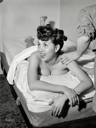 Photo showing: Chirp Relaxes -- April 1947. New York. Chirp (jazz vocalist Gloria King) discusses life while getting a massage.