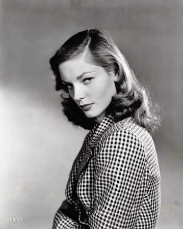 Photo showing: Lauren Bacall: 1924-2014 -- 1944. Actress Lauren Bacall, three-quarters portrait, in checked jacket.