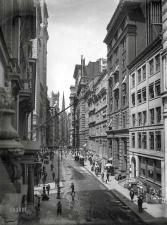 Photo showing: Corporate Canyon II -- New York circa 1910. View down Wall Street to Trinity Church.