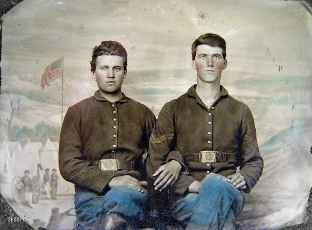 Photo showing: Civil Union -- Two Civil War soldiers in Union uniforms in front of painted backdrop showing military camp scene.