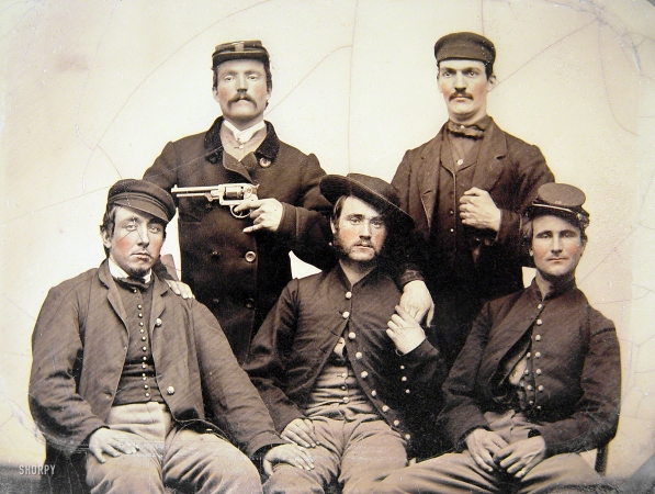 Photo showing: Droll Soldiers -- Ca. 1861-65. Unidentified men in Union uniforms, one pointing a revolver at another's head.