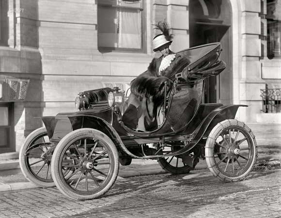 Photo showing: To the Borahmobile -- Washington, D.C., 1912. Mrs. William E. Borah, (wife of) Senator from Idaho, in Baker Electric.