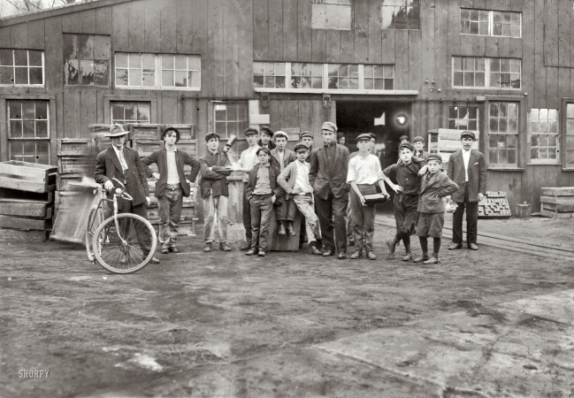 Photo showing: Bottle Club -- November 1909. Some of night shift waiting to go to work. Cumberland Glass Works, Bridgeton, New Jersey.