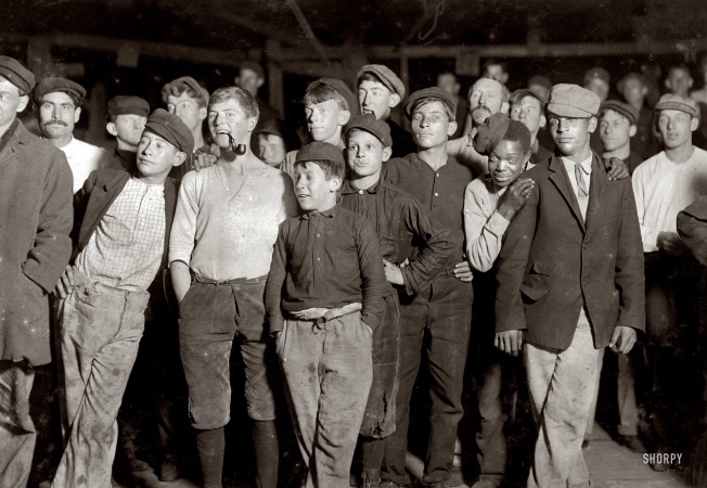 Photo showing: Glass Menagerie -- Nov. 15, 1909. Bridgeton, N.J. A few of the workers on night shift at Cumberland Glass Works. One boy is 13 years old.