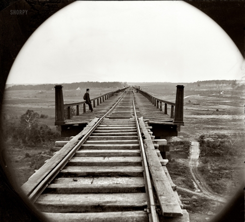 Photo showing: High Bridge -- April 1865. Farmville, Virginia, vicinity. High bridge of the South Side Railroad across the Appomattox.