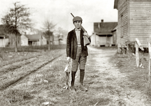 Photo showing: Bunny Hunter -- December 1908. Dillon, S.C. Charley Baxley. Has doffed 4 years at Dillon Mills. Had been out hunting.