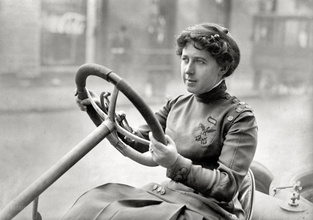 Photo showing: In the Drivers Seat -- Record-breaking race car driver Mrs. Joan Newton Cuneo in her 1908 Knox Giant.