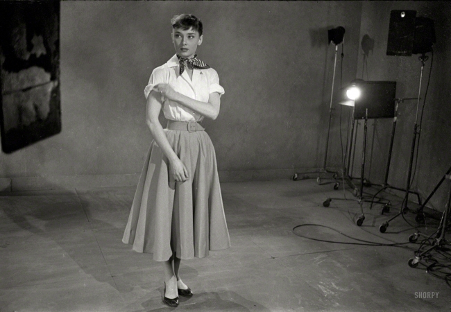 Photo showing: Audreys New Look -- April 1952. Actress Audrey Hepburn experimenting with
various hairstyles, wigs, and makeup for film Roman Holiday.