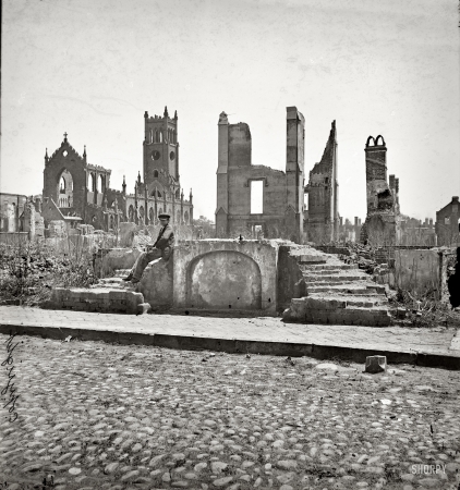 Photo showing: Ashes by Now -- 1865. Charleston, South Carolina, after the Bombardment. Ruins of the Cathedral of St. John and St. Finbar.