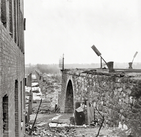 Photo showing: Bridge Out -- April 1865. Richmond, Virginia. Ruins of Richmond & Petersburg Railroad bridge.
