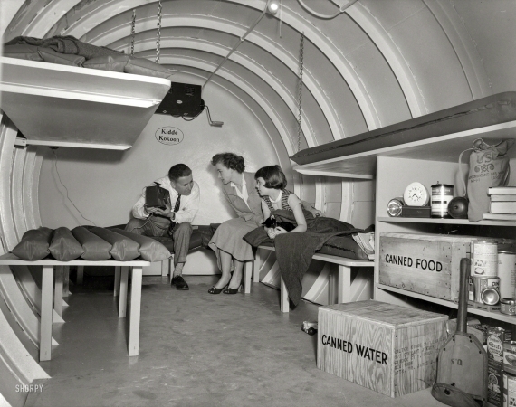 Photo showing: Kidde Kokoon -- 1955. H-bomb hideaway. Family seated in a Kidde Kokoon, an underground fallout
shelter manufactured by Walter Kidde Nuclear Laboratories of Garden City, Long Island.