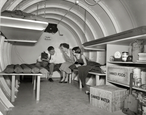 Photo showing: Kidde Kokoon -- 1955. H-bomb hideaway. Family seated in a Kidde Kokoon, an underground fallout
shelter manufactured by Walter Kidde Nuclear Laboratories of Garden City, Long Island.