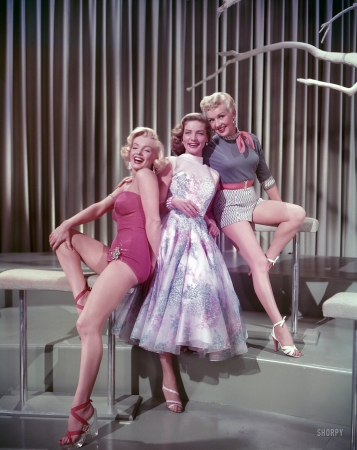 Photo showing: How to Marry a Millionaire -- 1953. Marilyn Monroe, Lauren Bacall and Betty Grable in a publicity still for the movie How to Marry a Millionaire.