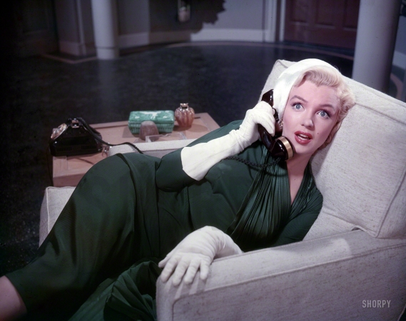 Photo showing: Dial M for Marilyn -- 1953. Marilyn Monroe enacting a scene from the motion picture How to Marry a Millionaire. 