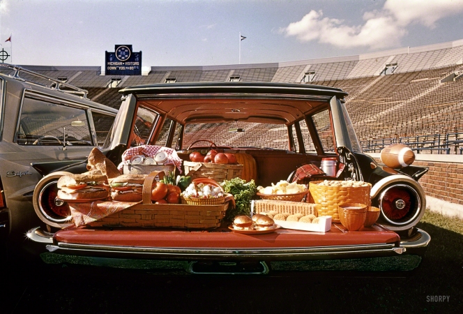 Photo showing: Tailgate Gourmet -- Fall 1960. A  Food for a tailgate picnic displayed in the back a Ford Country Squire station wagon.