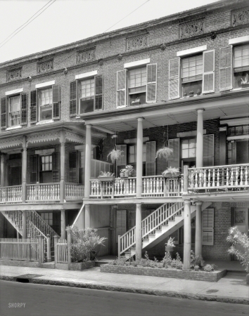 Photo showing: Hanging on the Porch -- 1937. Charleston, South Carolina. 18 & 20 Wentworth Street.