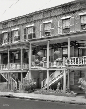 Photo showing: Hanging on the Porch -- 1937. Charleston, South Carolina. 18 & 20 Wentworth Street.