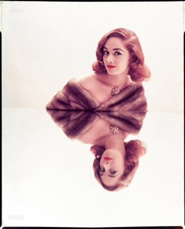 Photo showing: Doppelginger -- July 1952. Reflected Beauty: Hair Now Gets Double Exposure.