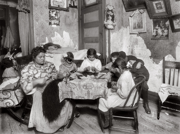 Photo showing: Tenement Piecework -- New York. December 1911. The Mauro family at 309 E. 110th St.