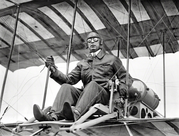 Photo showing: Up Worthy -- July 1910. New York. Clifford B. Harmon seated in aeroplane.