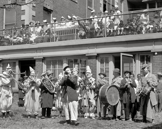 Photo showing: Clown Concert -- Circus clowns entertain at a Washington, D.C. area children's hospital, May 1, 1923.