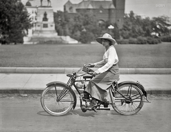 Photo showing: Hybrid Vehicle -- Washington, D.C., circa 1918. Woman on motorized bicycle.