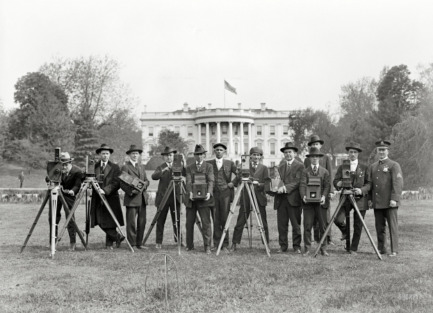 Photo showing: White House Photographers -- 1918. Press correspondents. Photographers on White House lawn.