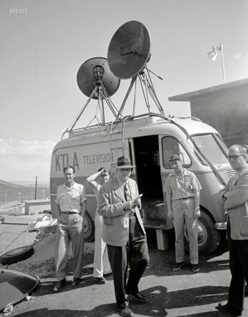 Photo showing: KTLA-Bomb -- 1952. Journalists standing in front of a KTLA television truck at Camp Mercury
Proving Grounds; present to record an atomic bomb detonation in the Nevada desert.