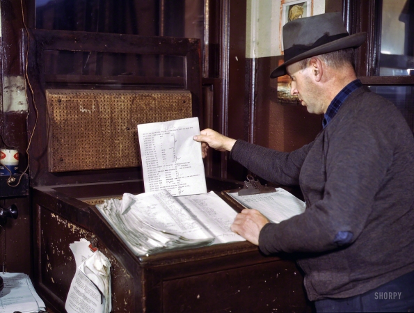 Photo showing: The Hump Office -- December 1942. Switch lists coming in by teletype to the
hump office at a Chicago & North Western railroad yard, Chicago.