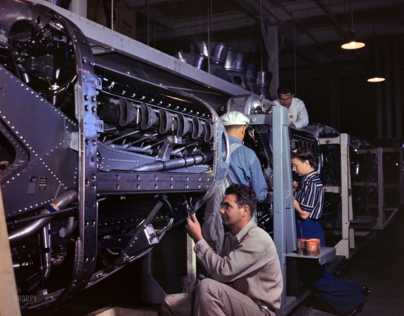 Photo showing: How to Make a Mustang -- October 1942. Inglewood, California, North American Aviation. Assembling the cowling of a P-51 'Mustang' fighter.