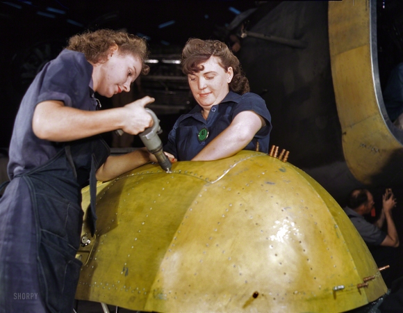 Photo showing: The Avengers -- February 1943. Working on a 'Vengeance' dive bomber at Vultee Aircraft in Nashville, Tennessee.