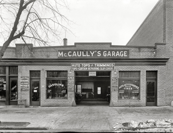 Photo showing: McCaullys Garage -- Washington, D.C., circa 1921. McCaully's garage.