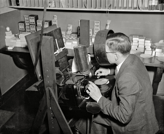 Photo showing: Bureau of Standards -- Dec. 23, 1936. Washington, D.C. Bureau of Standards. Standardization of card colors. Kenneth Kelley judging colors of dyes.