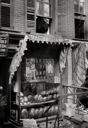 Photo showing: Fancy Cakes -- New York circa 1910, somewhere on the Lower East Side. Bread for the poor.