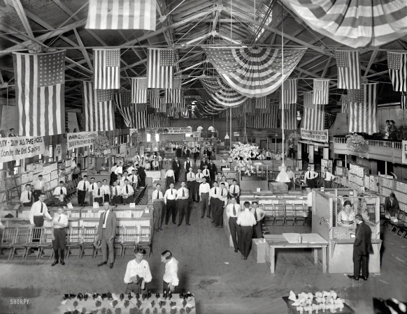 Photo showing: Shoe City -- Hahn's Coliseum, interior. A footwear sale held by the Hahn's chain
of shoe stores at Washington D.C.'s Center Market in July 1920.