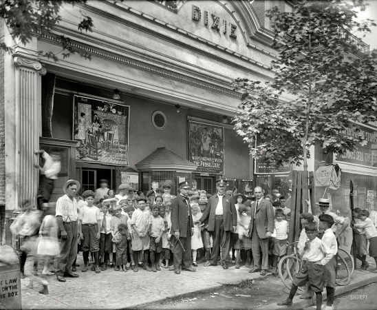 Photo showing: Dixie Theater Matinee -- Washington, D.C., 1920. Dixie Theater crowd, H Street. Now playing: Episode 2 (The Murder Mood)
of Hidden Dangers, The Primal Lure and When Cowboy Was King.