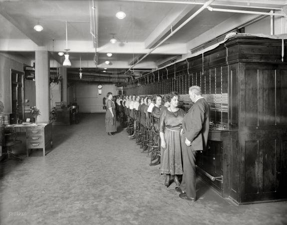 Photo showing: Navy Telephone Exchange -- Washington, D.C., circa 1920. Josephus Daniels, Secretary of the Navy, and Navy telephone exchange.