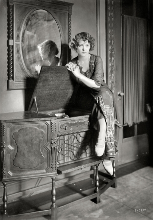 Photo showing: Play Me -- New York circa 1921. A lady and her phonograph.