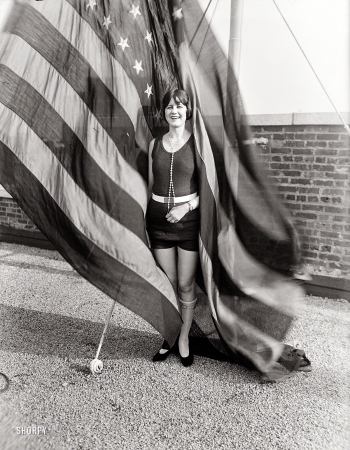 Photo showing: The Unknown Trouper -- From 1924 comes our patriotic girl with the pearls.
