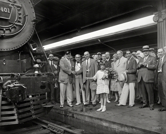 Photo showing: Train Christening -- July 14, 1929. Washington, D.C. Ten-year-old Ellen Page Eaton will break a bottle of Potomac River water on the locomotive
of a new Pennsylvania Railroad train this morning at 11 o'clock in the Union Station and christen it 'The Senator.'