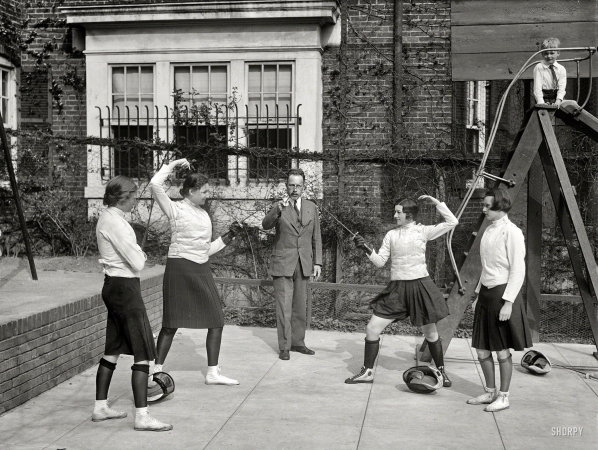 Photo showing: Ladies Who Lance -- April 16, 1930. Washington society girls will compete for fencing title of the District of Columbia at the Mayflower Hotel.
Elizabeth Bunting, judge; Priscilla Holcombe; Maj. Walter E. Blunt, referee; Margaret Montgomery; and Lillian Shuman, judge.