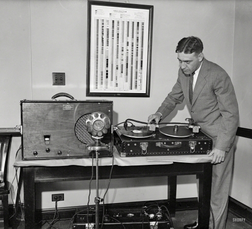 Photo showing: D.C. DJ -- Washington, D.C., 1931. Man with portable radio receiver and phonograph.