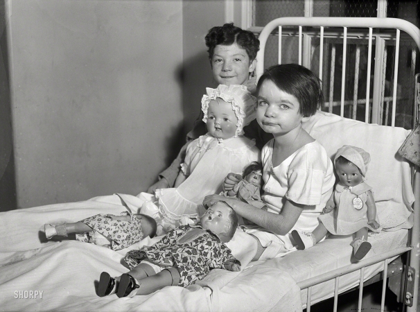 Photo showing: Doll Bed -- Washington, D.C., 1931. Children in hospital bed with dolls.