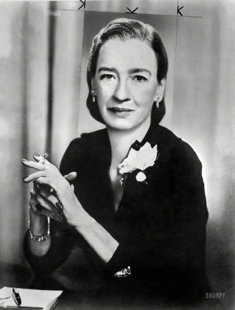 Photo showing: Amazing Grace -- Dr. Grace Hopper, director, Systems Research, Remington Rand, half-length portrait, smoking cigarette.