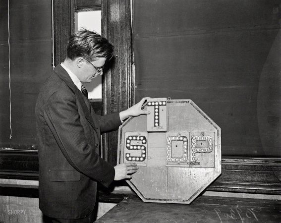 Photo showing: Reflections on a Stop Sign -- March 1936. Washington, D.C. Man with stop sign.
