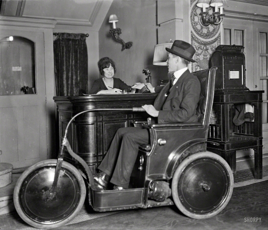 Photo showing: Chair Car -- January 1922. Washington, D.C. Man in three-wheeled vehicle.