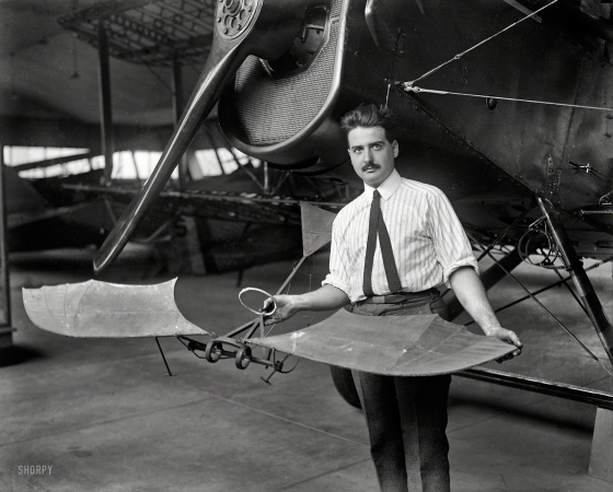 Photo showing: The Bat-Plane -- 1923. Washington, D.C., or vicinity. Man with airplane in hangar.