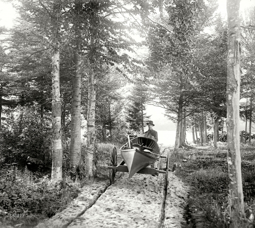 Photo showing: Canoemobile: 1902 -- The Adirondack Mountains, New York. An Adirondack hand cart carry.